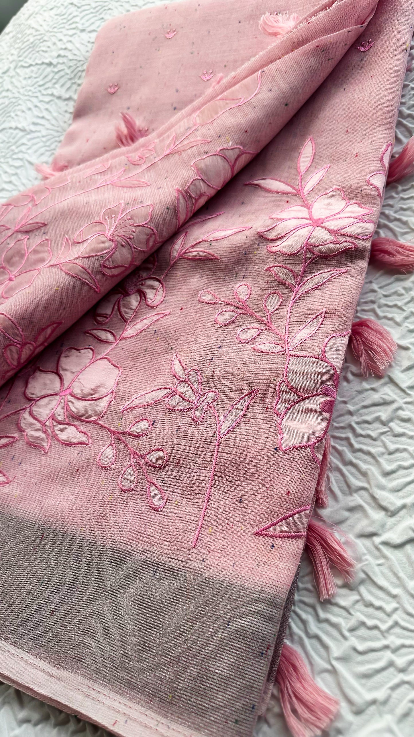Soft Pink Linen Saree with Floral Appliqué Work & Tassel Detailing