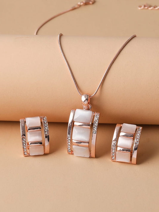 Rose gold jewellery set with white shell inlays and crystal accents featuring geometric pendant necklace and matching hoop earrings - contemporary designer jewellery UK