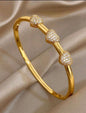 Gold-Tone Triple Heart Crystal Bangle Bracelet