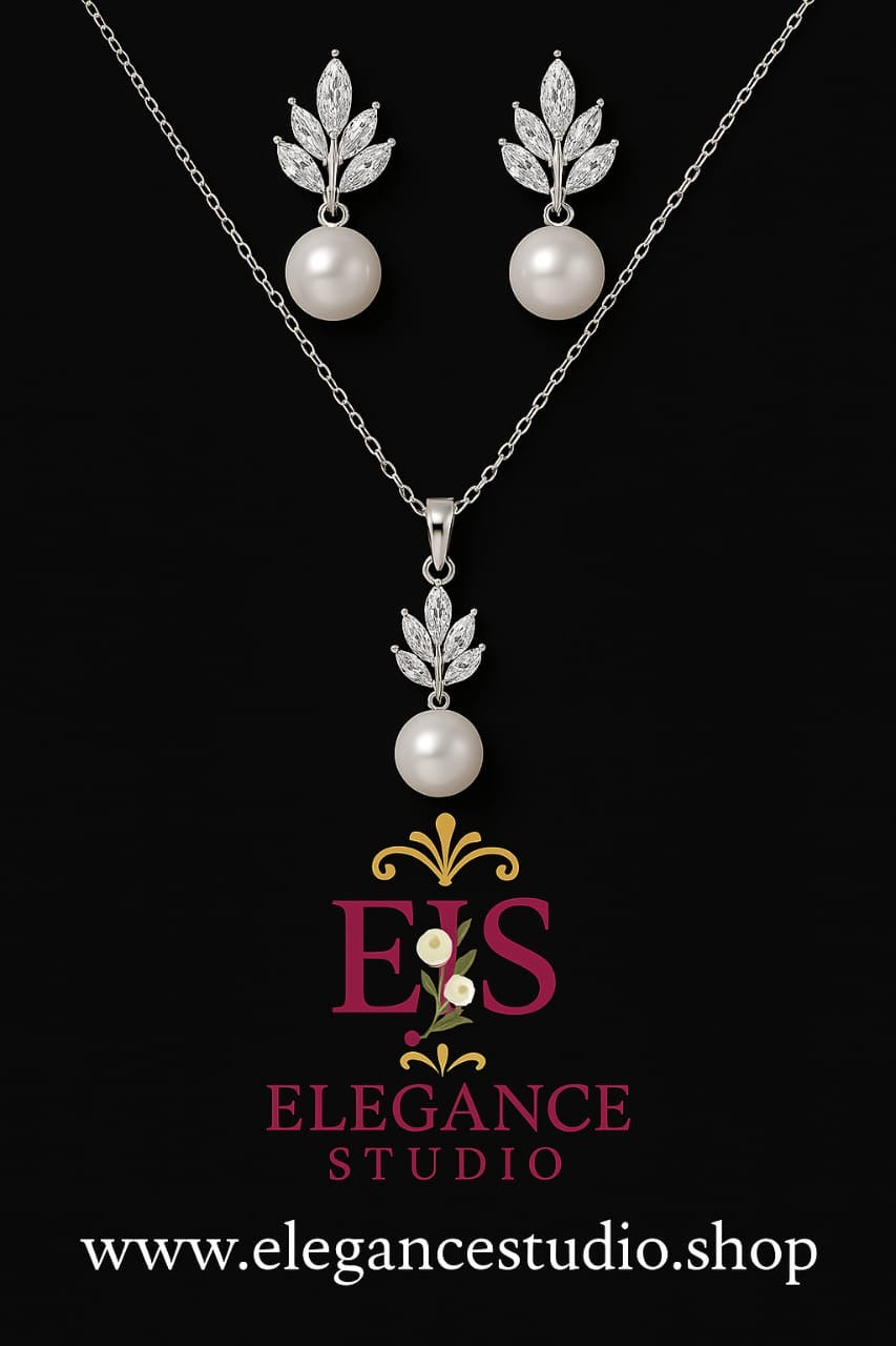 Silver crystal leaf and pearl necklace and earrings jewelry set with botanical design and elegant bridal styling on black background
