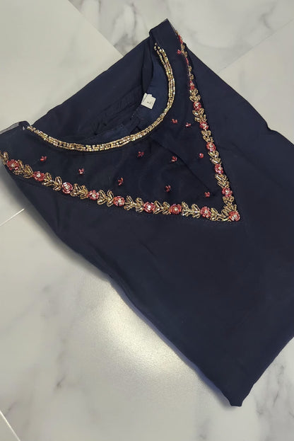 Navy blue silk embroidered dress with gold and red beadwork — elegant Christmas outfit for festive evenings.