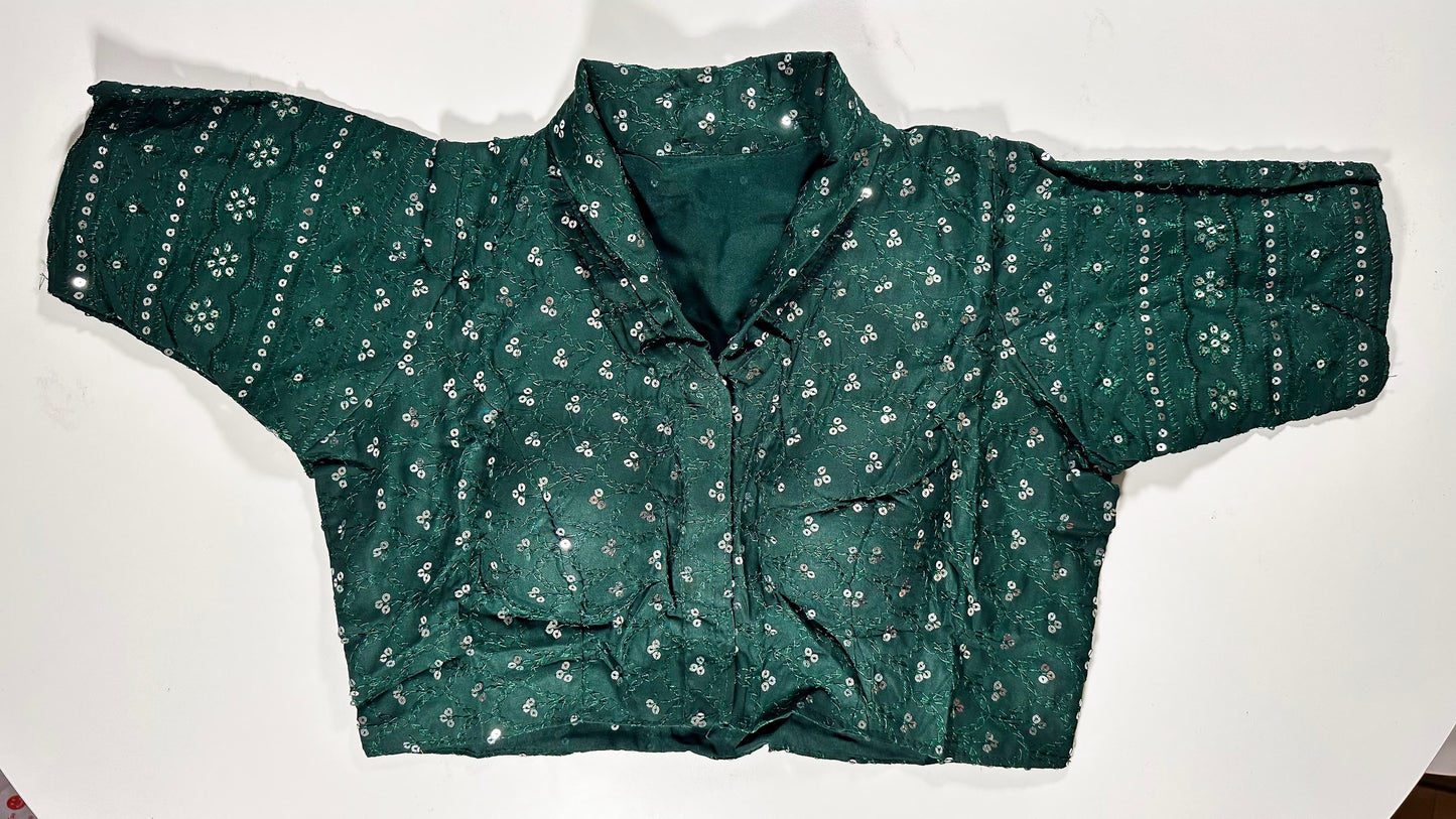 Elegant emerald green silk saree blouse with all-over sequin and mirror work embellishments - luxury Indian wedding choli for UK formal celebrations