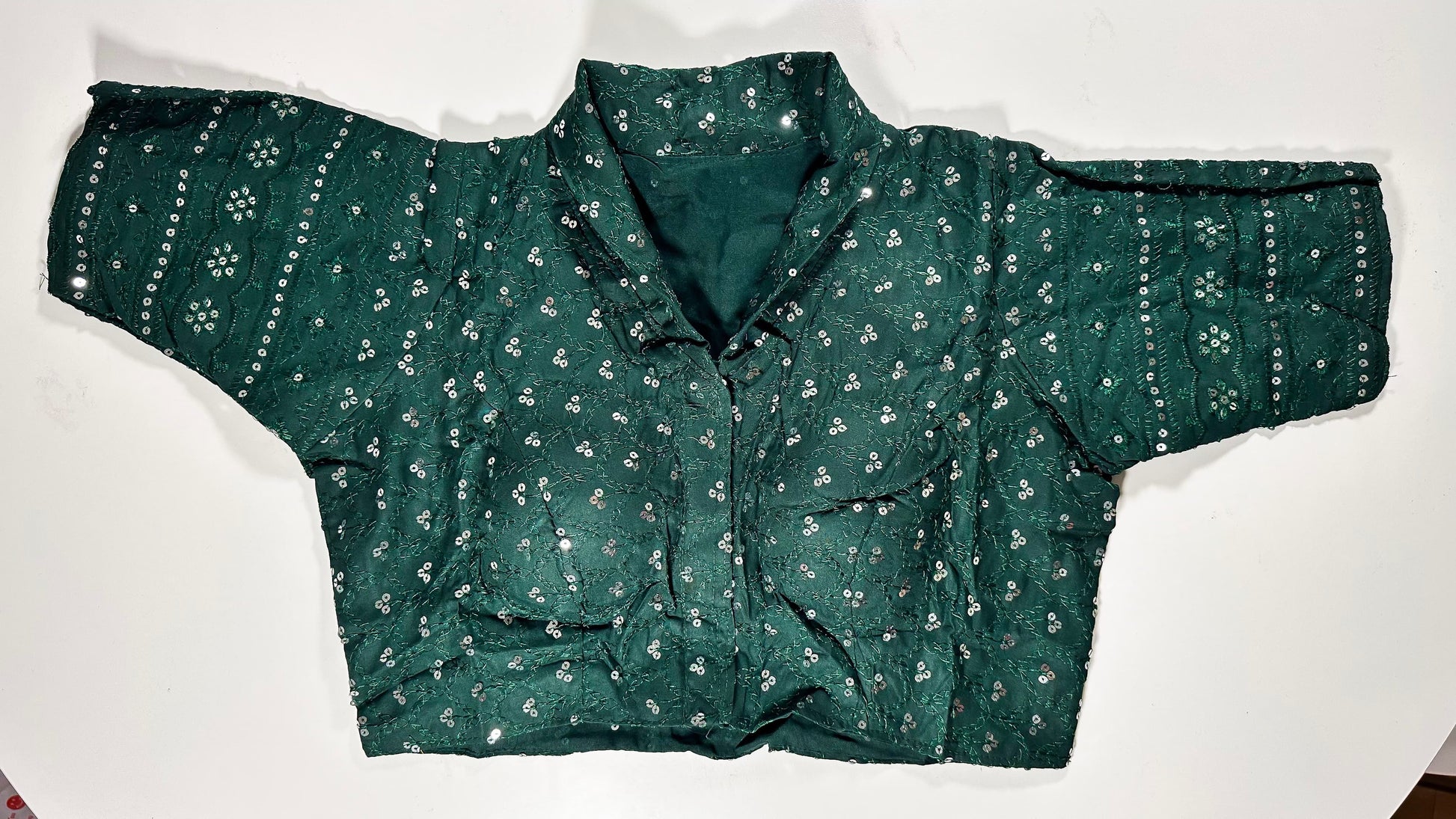 Elegant emerald green silk saree blouse with all-over sequin and mirror work embellishments - luxury Indian wedding choli for UK formal celebrations