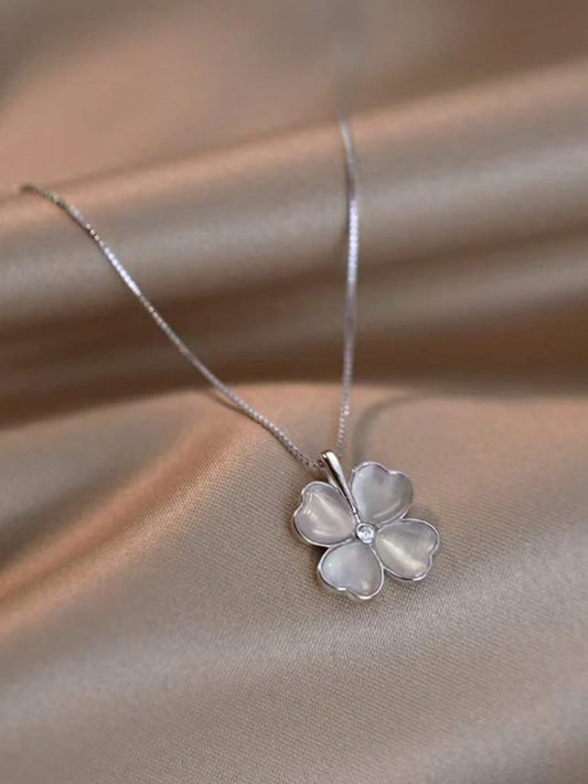 Elegant silver necklace with mother of pearl flower pendant featuring heart-shaped petals and crystal centre - delicate feminine jewellery UK