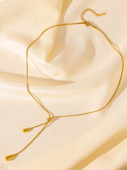 Elegant gold adjustable lariat necklace with teardrop pendants and sliding mechanism in luxury gift box - contemporary designer jewellery UK