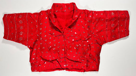 Vibrant red silk saree blouse with all-over sequin and mirror work embellishments - traditional Indian bridal choli for UK wedding celebrations