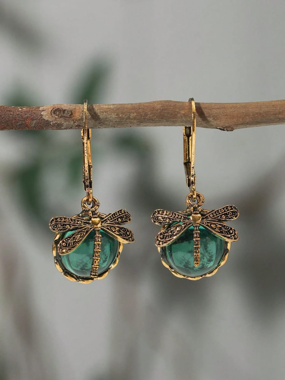 Enchanting vintage gold dragonfly earrings with coloured crystal drops in aqua blue, emerald green and amber yellow - nature-inspired designer jewellery UK