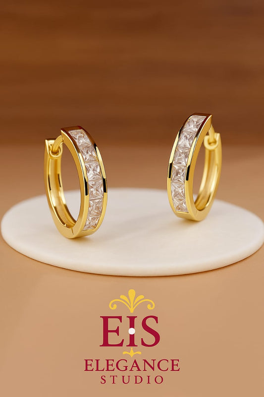 Elegant hoop earrings with crystal embellishments in gold plated and silver finishes