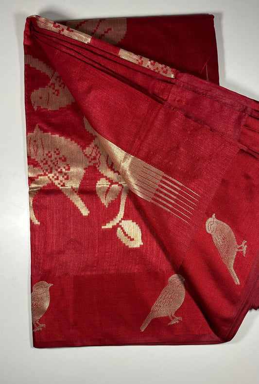  Red silk saree with woven bird and floral motifs showing traditional Indian wedding design and lustrous silk fabric with gold zari work