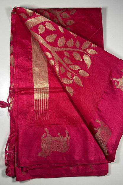 Magenta silk saree fabric texture with Gau Mata patterns and gold zari work showing spiritual and cultural significance