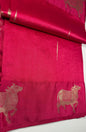 Magenta silk saree fabric texture with Gau Mata patterns and gold zari work showing spiritual and cultural significance