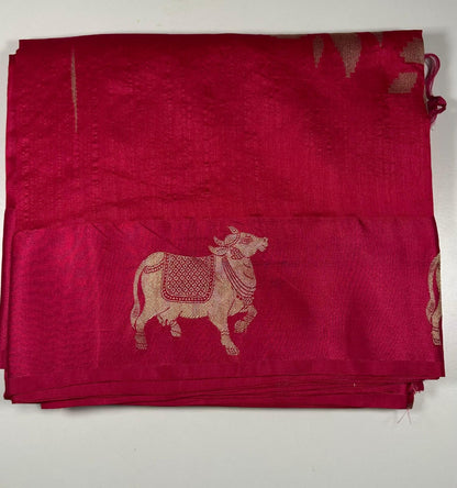 Traditional Hindu magenta silk saree with sacred cow motifs displayed showing religious and festival wear quality