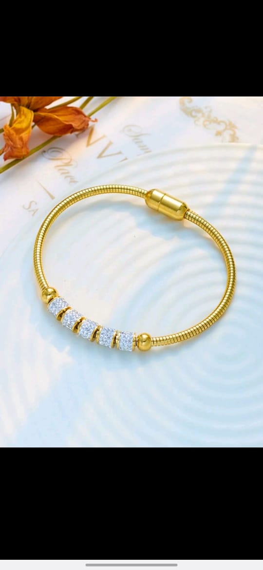 Elegant gold snake chain bracelet with crystal pavé beads and magnetic clasp closure in luxury gift box - contemporary designer jewellery UK