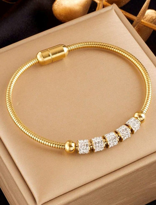 Elegant gold snake chain bracelet with crystal pavé beads and magnetic clasp closure in luxury gift box - contemporary designer jewellery UK
