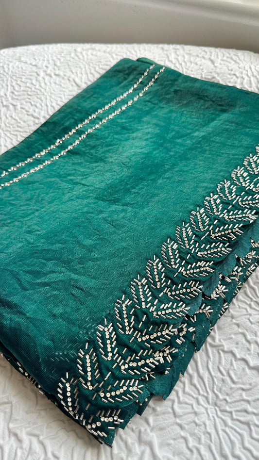 Luxurious emerald green silk saree with intricate silver hand embroidery featuring botanical leaf patterns and pearl accents - premium Indian designer saree UK