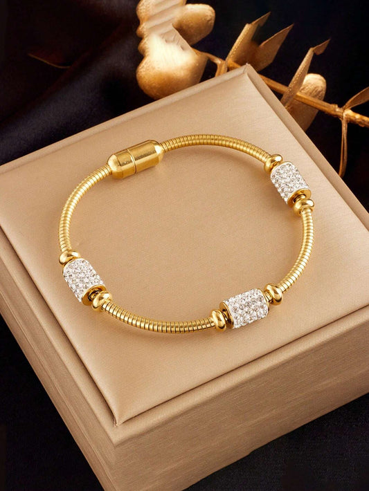 Gold tone crystal charm bracelet on marble surface - Indian ethnic jewellery UK online