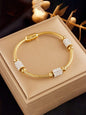 Gold tone crystal charm bracelet on marble surface - Indian ethnic jewellery UK online