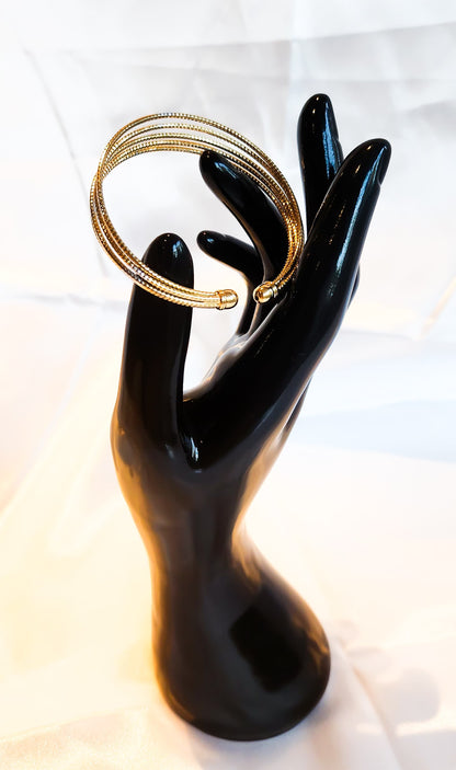 Multi-layered gold and silver bangle design for women