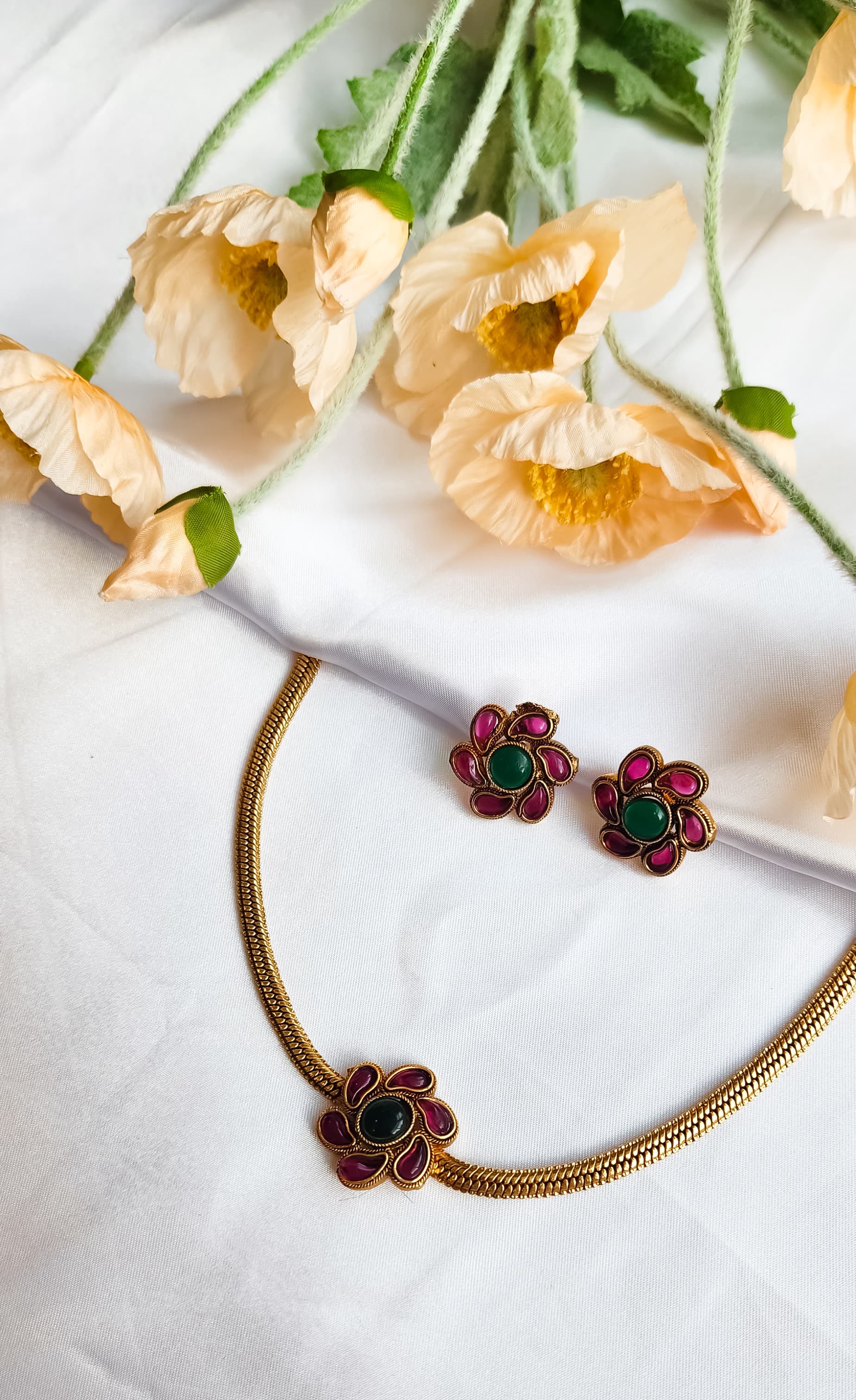 Multi-Coloured Floral Bloom Necklace Set with vibrant enamel detailing and matching earrings, perfect for festive and party wear.
