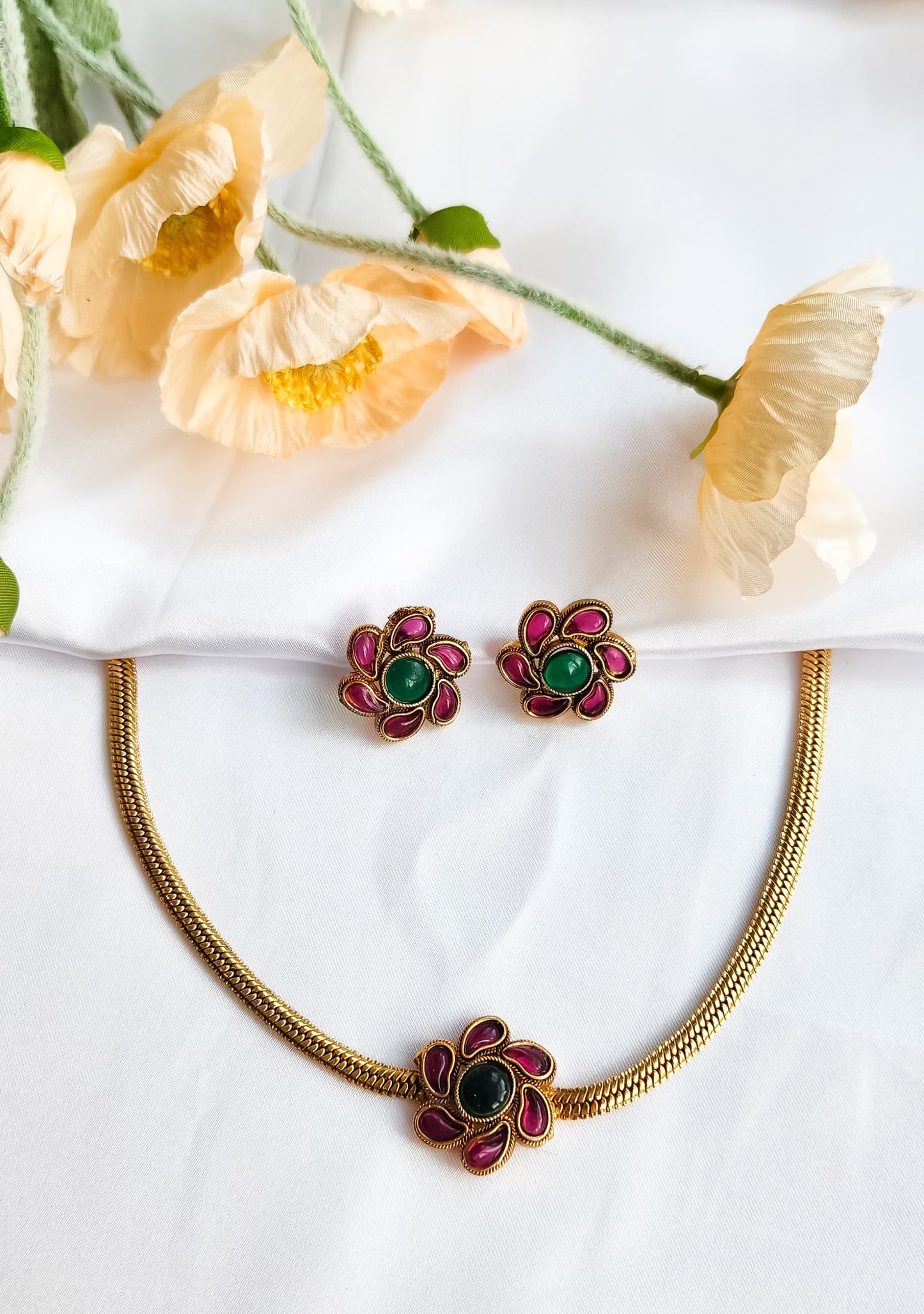 Multi-Coloured Floral Bloom Necklace Set with vibrant enamel detailing and matching earrings, perfect for festive and party wear.
