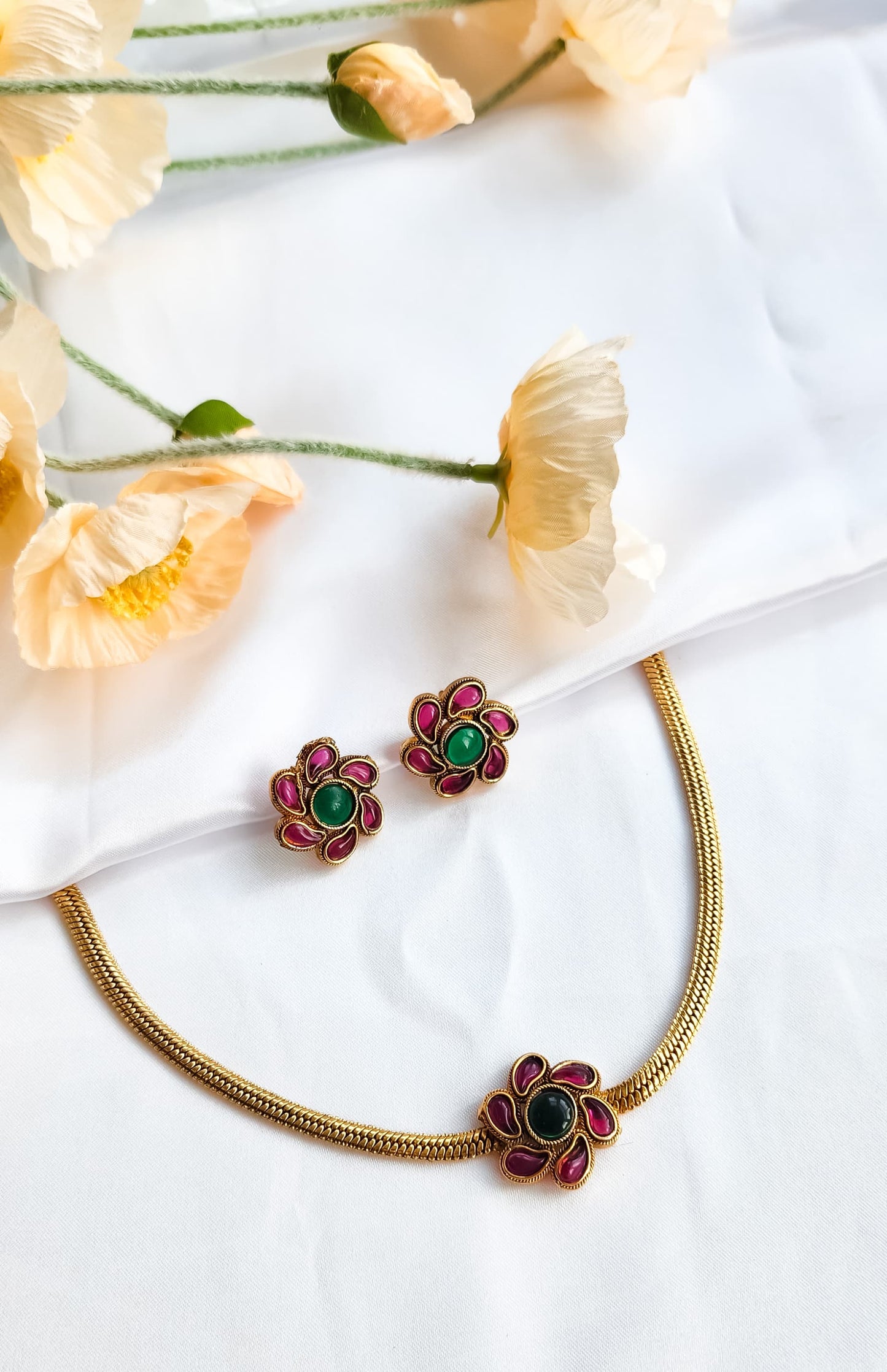 Multi-Coloured Floral Bloom Necklace Set with vibrant enamel detailing and matching earrings, perfect for festive and party wear.
