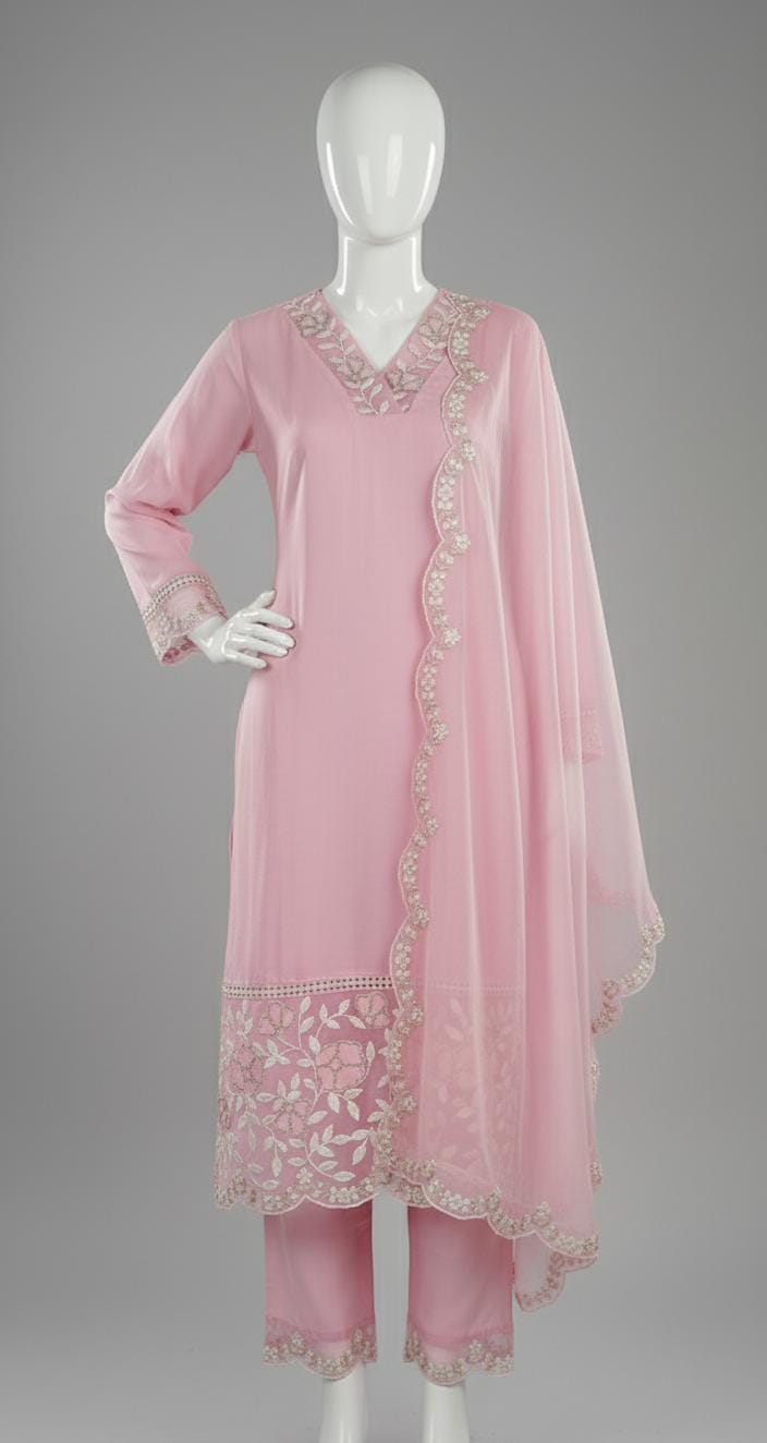 Pastel pink embroidered suit set with floral lace border, V-neck kurta, matching pants, and dupatta — elegant festive outfit for women.