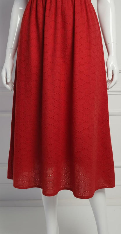 Elegant red cotton eyelet midi dress with puff sleeves, V-neckline, and flared skirt — perfect for casual and festive occasions.