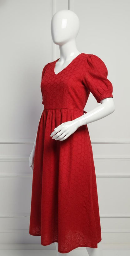 Elegant red cotton eyelet midi dress with puff sleeves, V-neckline, and flared skirt — perfect for casual and festive occasions.