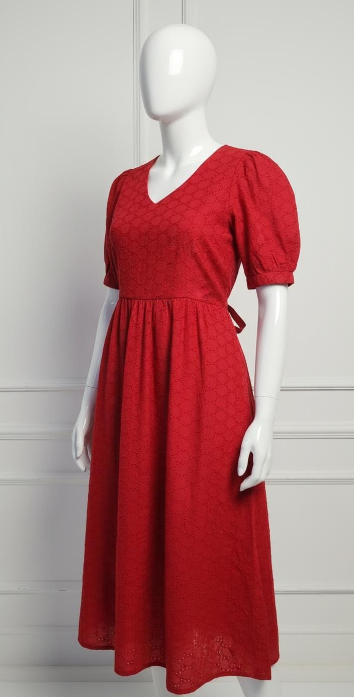 Elegant red cotton eyelet midi dress with puff sleeves, V-neckline, and flared skirt — perfect for casual and festive occasions.