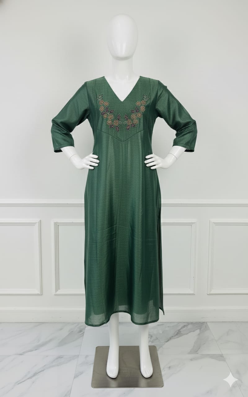 Emerald green silk embroidered dress with hand beadwork, V-neck design, and festive shimmer — elegant Christmas outfit for women.