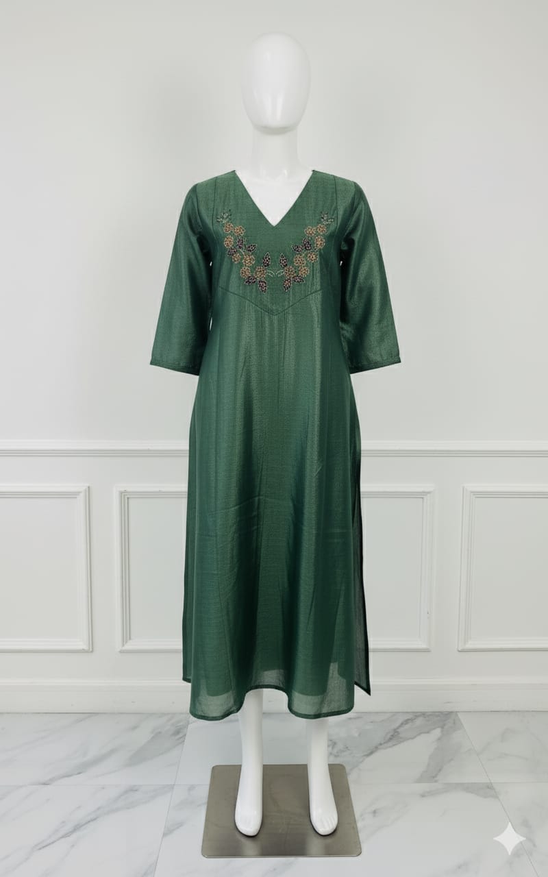 Emerald green silk embroidered dress with hand beadwork, V-neck design, and festive shimmer — elegant Christmas outfit for women.