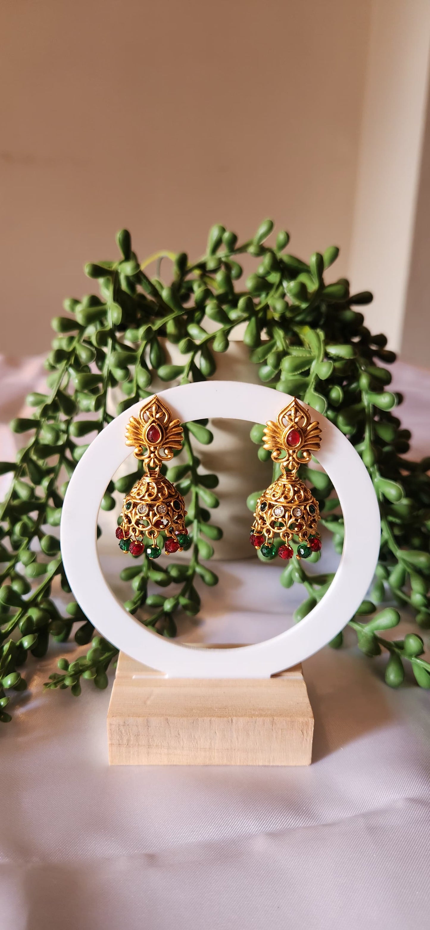Antique Gold Peacock Wing Jhumka Earrings with Bead Tassels