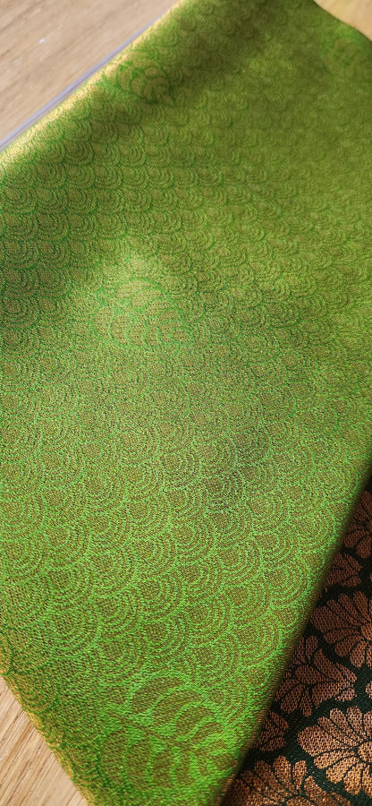 Kubera Silk Signature Traditional Border Saree with woven silk body and intricate traditional border, neatly styled on a tabletop with minimal décor.