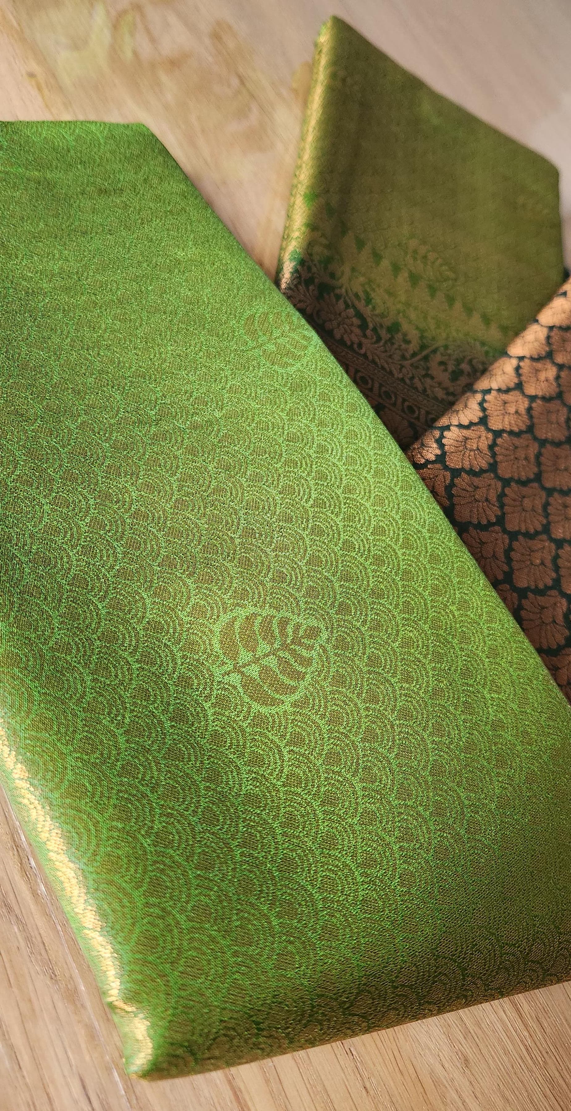 Kubera Silk Signature Traditional Border Saree with woven silk body and intricate traditional border, neatly styled on a tabletop with minimal décor.