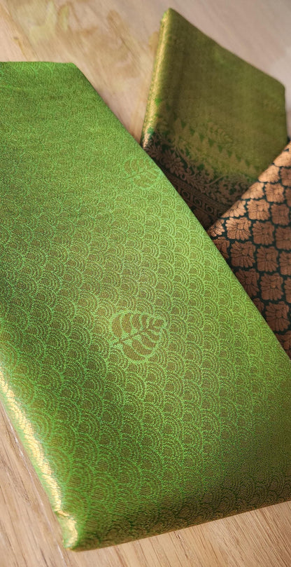 Kubera Silk Signature Traditional Border Saree with woven silk body and intricate traditional border, neatly styled on a tabletop with minimal décor.