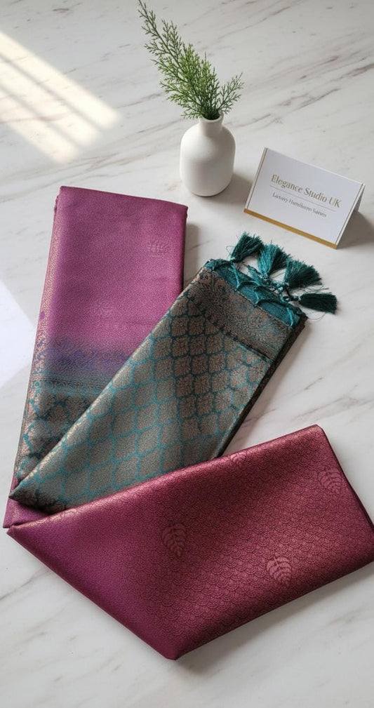 Kubera Silk Regal Motif Heritage Saree with woven silk body featuring subtle self-motifs and an intricately crafted traditional border, styled on a marble surface with minimal décor.