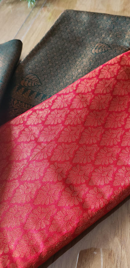 Kubera Silk Dual Weave Legacy Saree featuring a woven silk body with subtle self-patterns and a finely detailed traditional border, neatly styled on a wooden surface with classic décor.