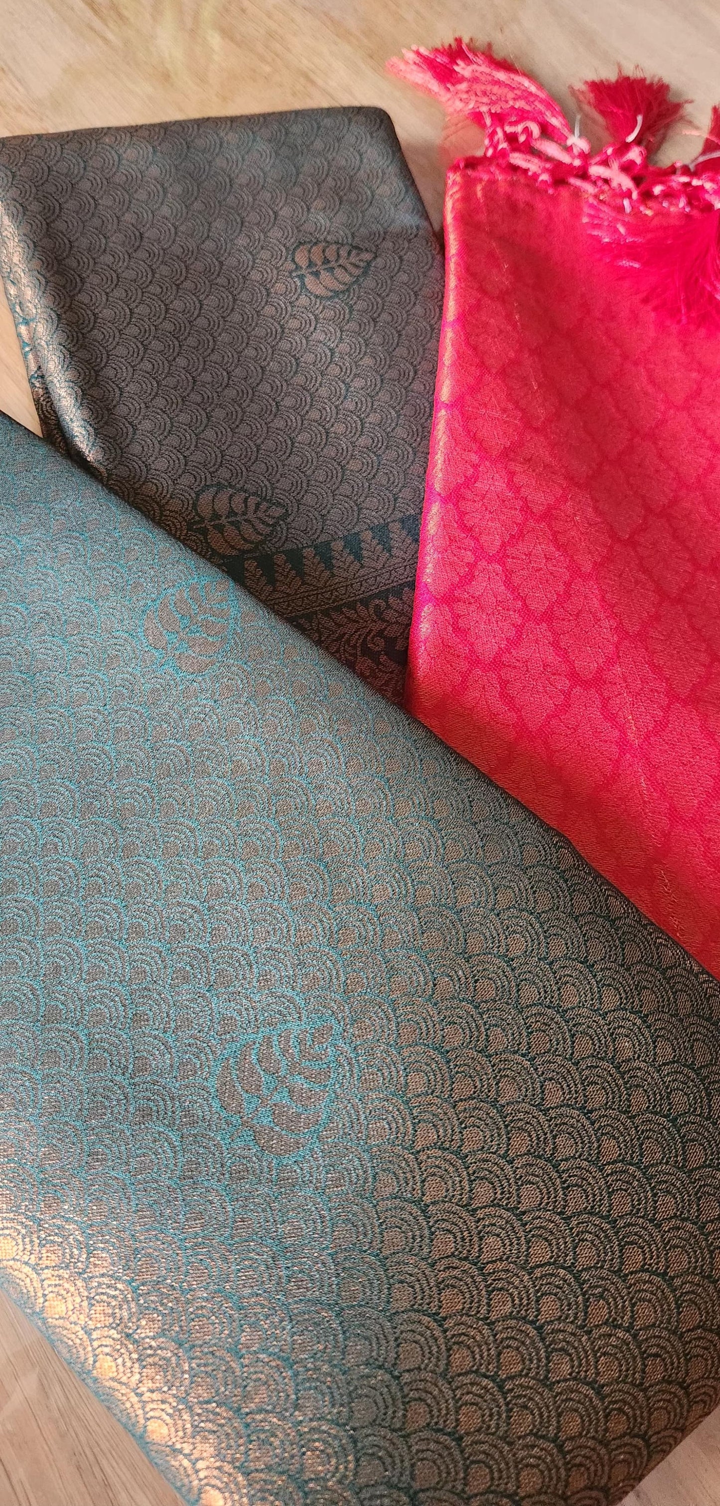 Kubera Silk Dual Weave Legacy Saree featuring a woven silk body with subtle self-patterns and a finely detailed traditional border, neatly styled on a wooden surface with classic décor.