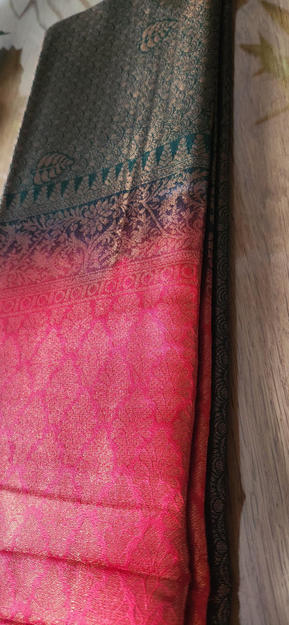 Kubera Silk Dual Weave Legacy Saree featuring a woven silk body with subtle self-patterns and a finely detailed traditional border, neatly styled on a wooden surface with classic décor.