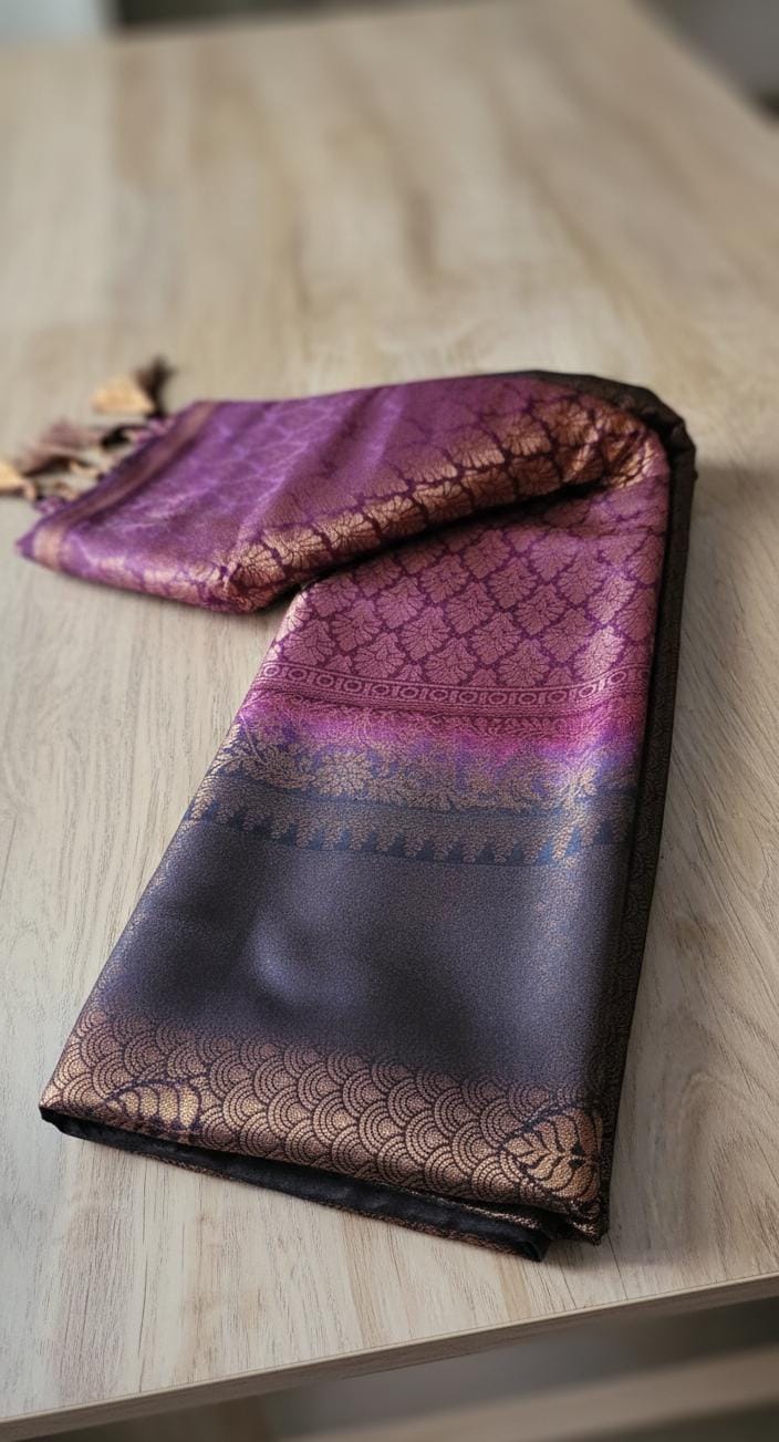 Kubera Silk Heirloom Weave Royale Saree featuring a woven silk body with intricate self-patterns and a finely crafted traditional border, styled on a wooden table with classic décor.