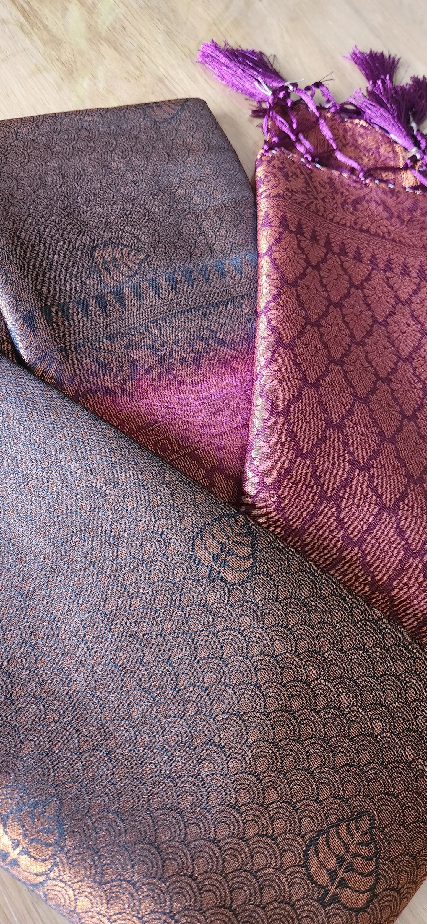 Kubera Silk Heirloom Weave Royale Saree featuring a woven silk body with intricate self-patterns and a finely crafted traditional border, styled on a wooden table with classic décor.