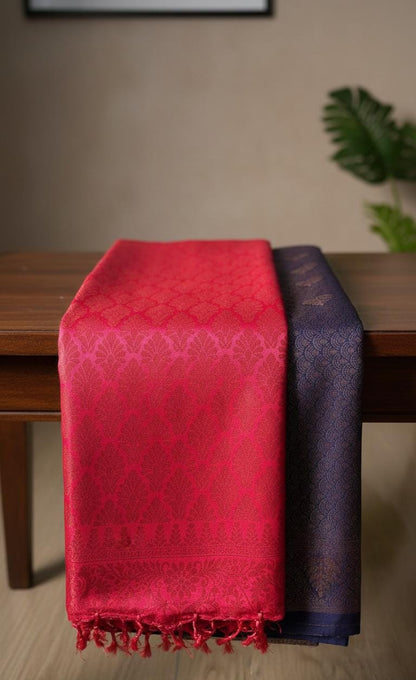 Kubera Silk Royal Contrast Weave Saree featuring a woven silk body with intricate self-patterns and a richly detailed traditional border, styled on a wooden table with classic décor.