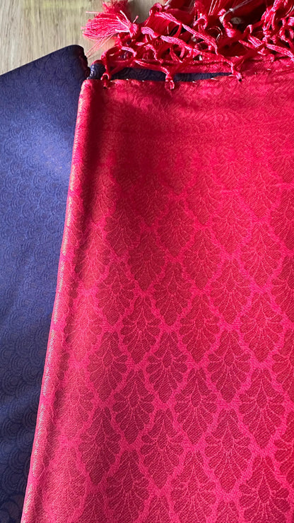 Kubera Silk Royal Contrast Weave Saree featuring a woven silk body with intricate self-patterns and a richly detailed traditional border, styled on a wooden table with classic décor.