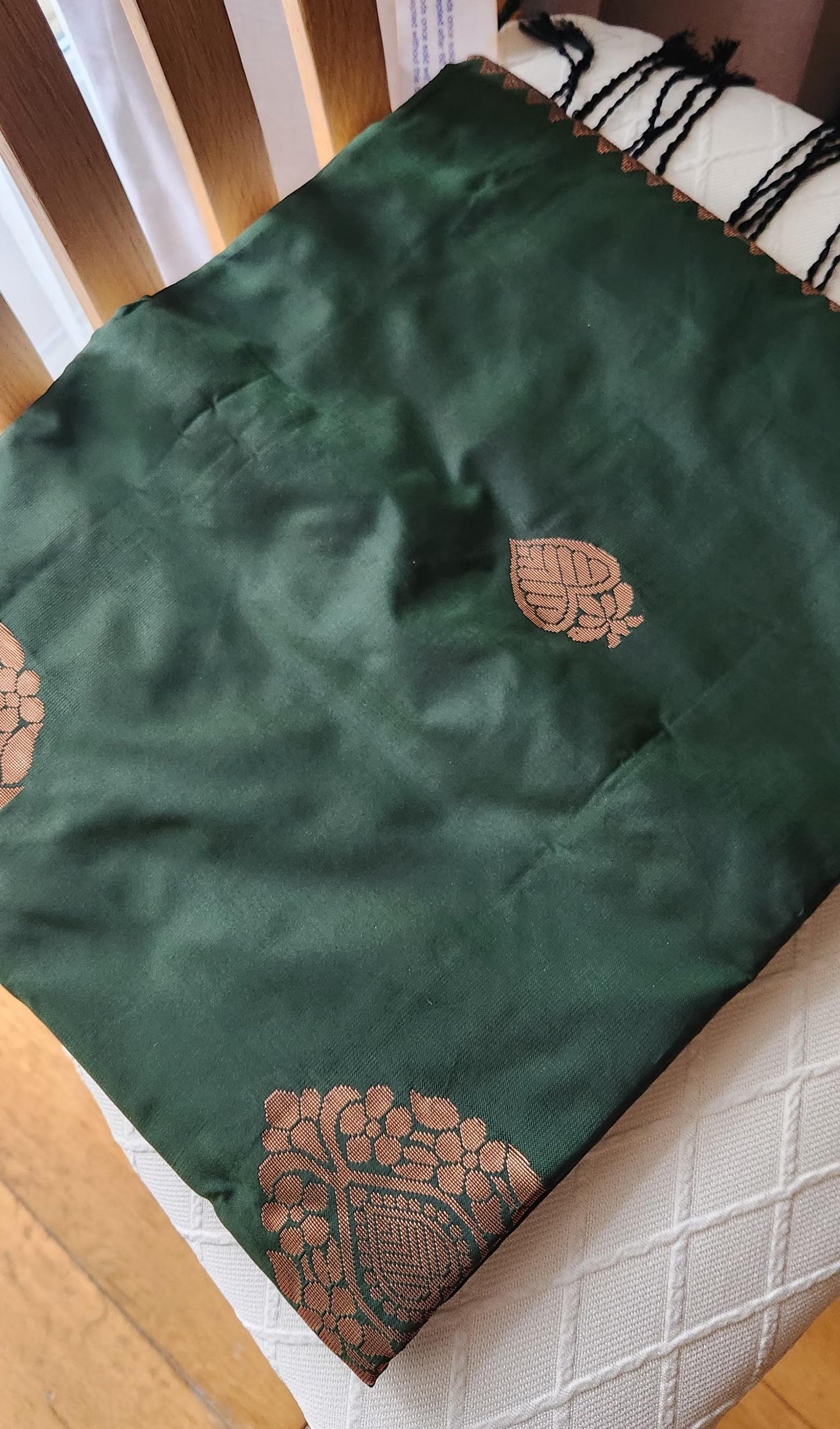 Traditional emerald green silk saree with woven floral motifs