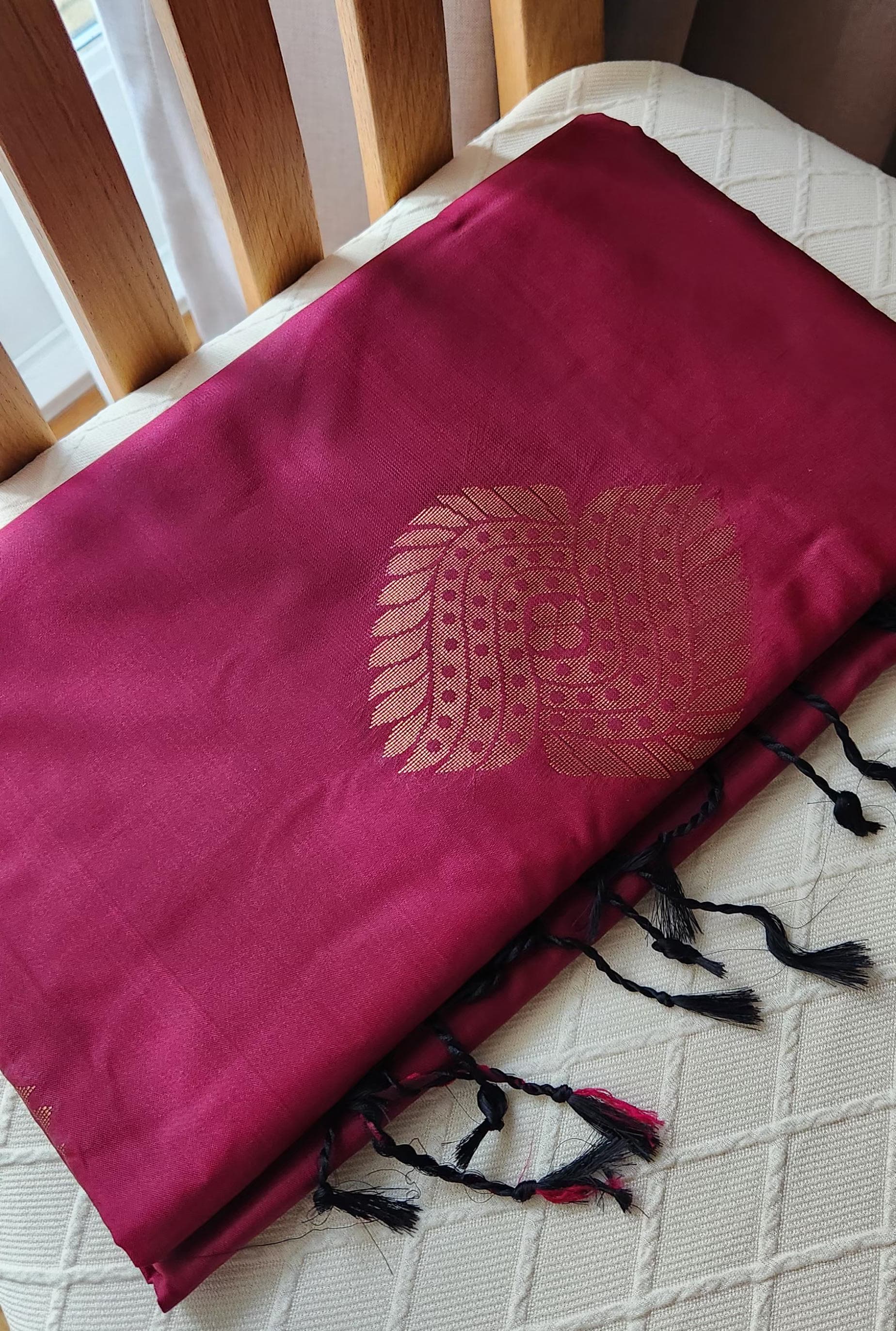 Wine garnet soft silk saree with antique gold zari pallu and woven motifs