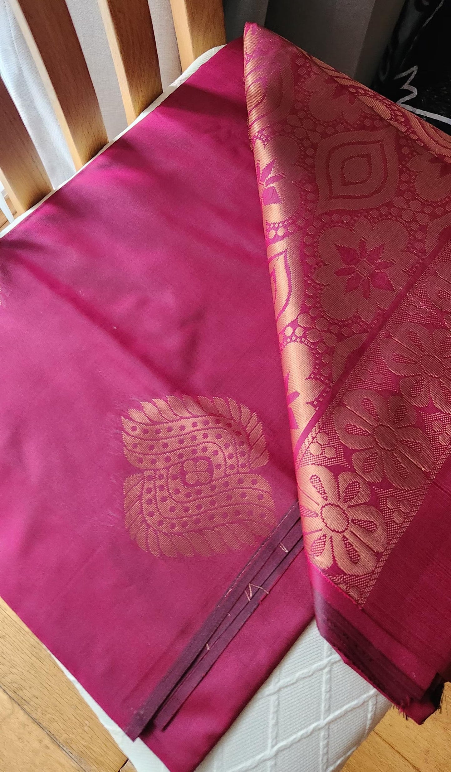 Wine garnet soft silk saree with antique gold zari pallu and woven motifs