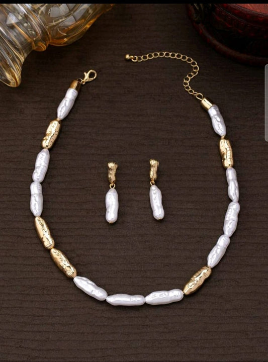 Elegant baroque pearl jewellery set with gold accents featuring statement necklace and matching drop earrings - contemporary organic pearl jewellery UK