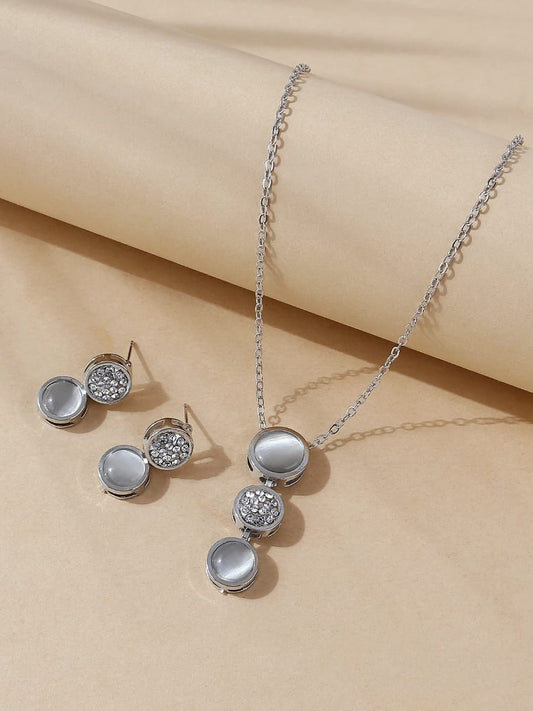 Elegant silver jewellery set with crystal and pearl necklace and matching stud earrings - coordinated designer jewellery for UK formal occasions