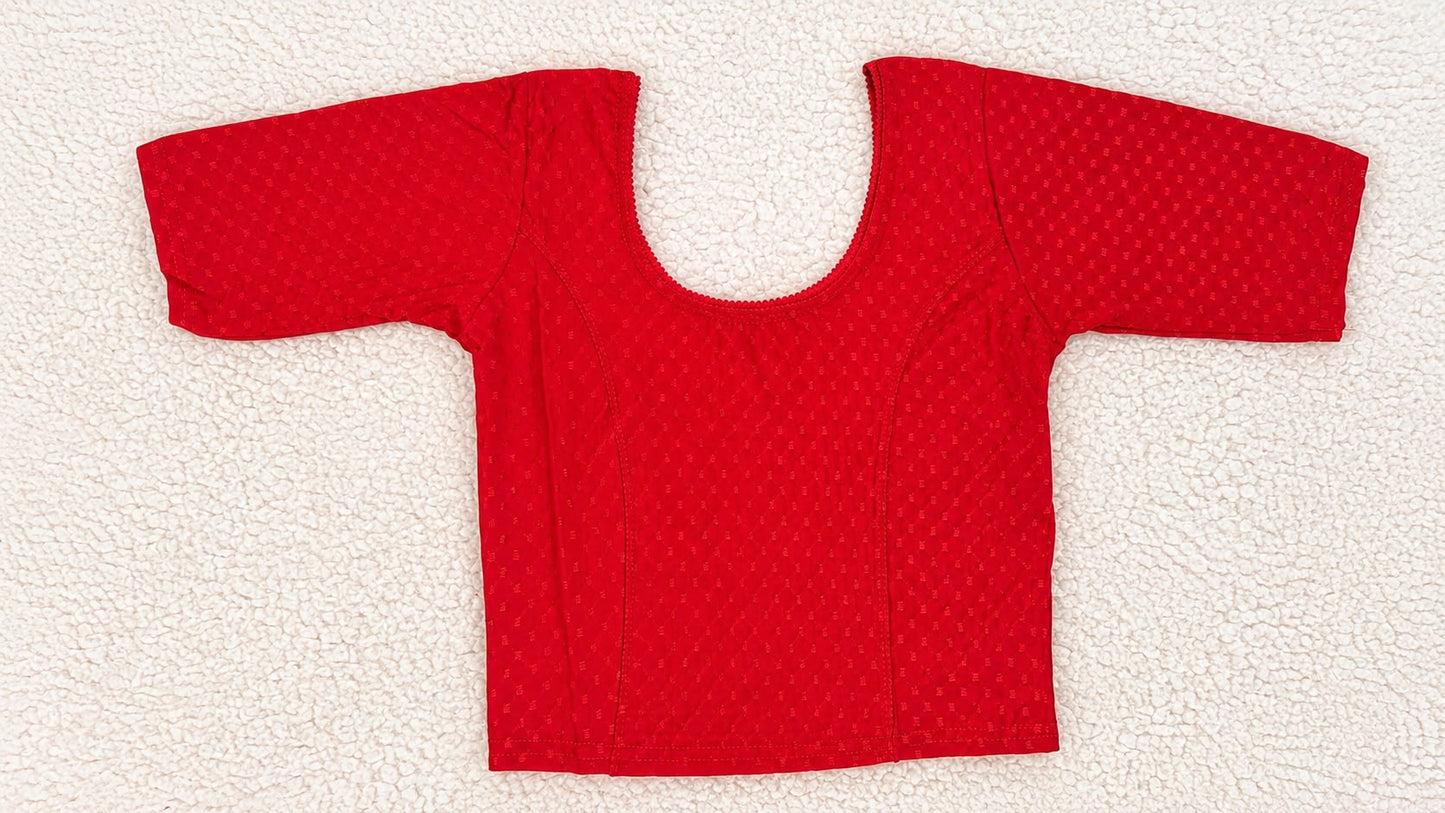 Red fabric piece with a circular cutout on a white background