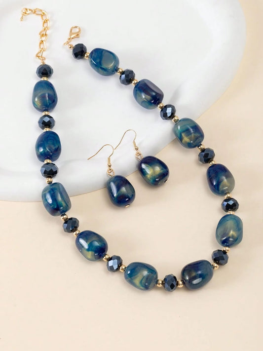 Elegant blue agate beaded jewellery set with gold accents featuring statement necklace and matching drop earrings - natural stone jewellery for UK formal occasions